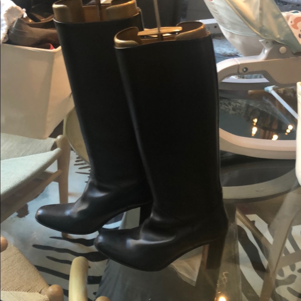 Black leather high-heeled boots